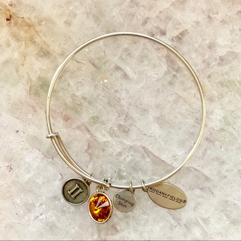RODAN & FIELDS LEVEL II GARNET CHARM BRACELET